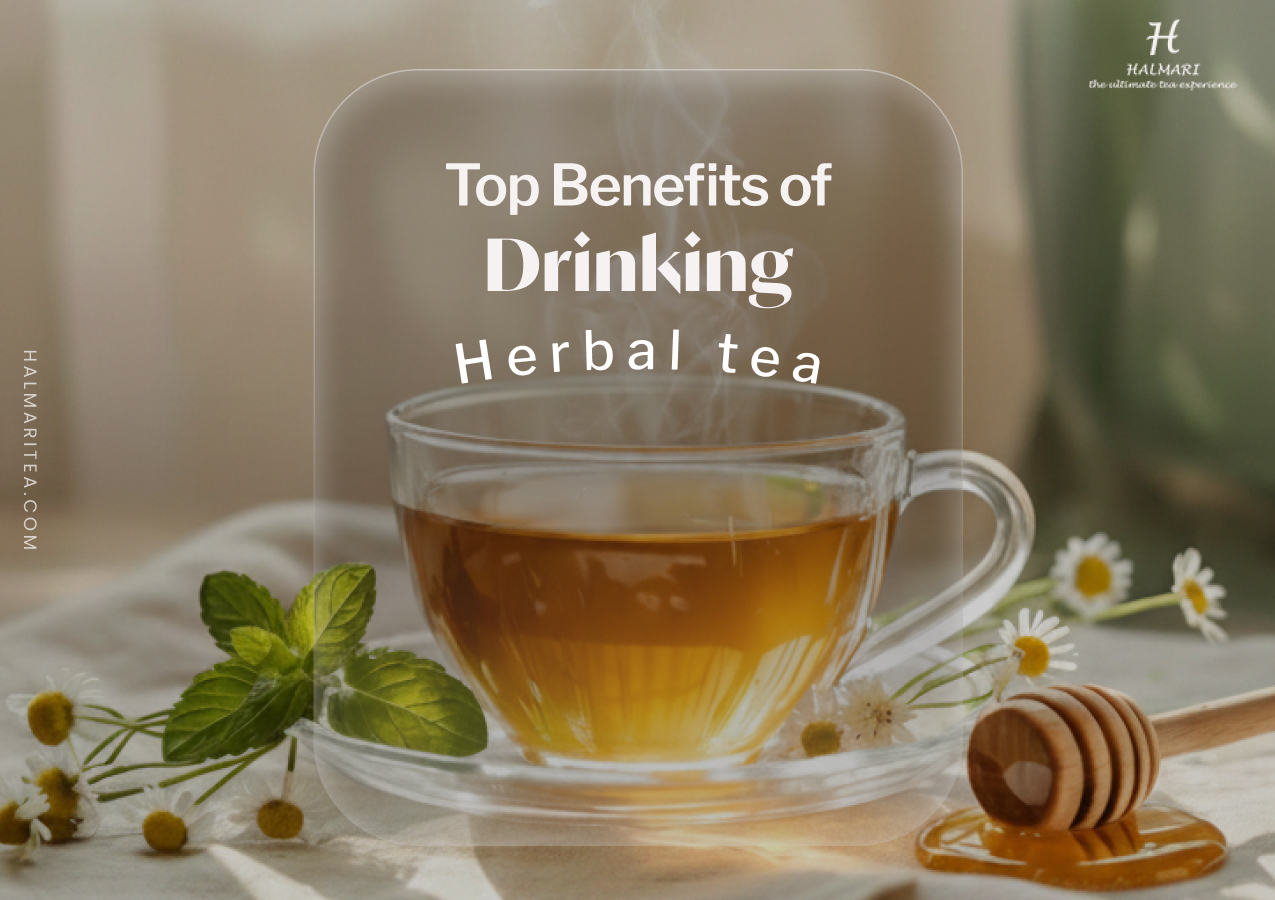 Steaming cup of herbal tea with fresh mint leaves, chamomile flowers, and honey, illustrating the health benefits of drinking herbal tea for relaxation and wellness.